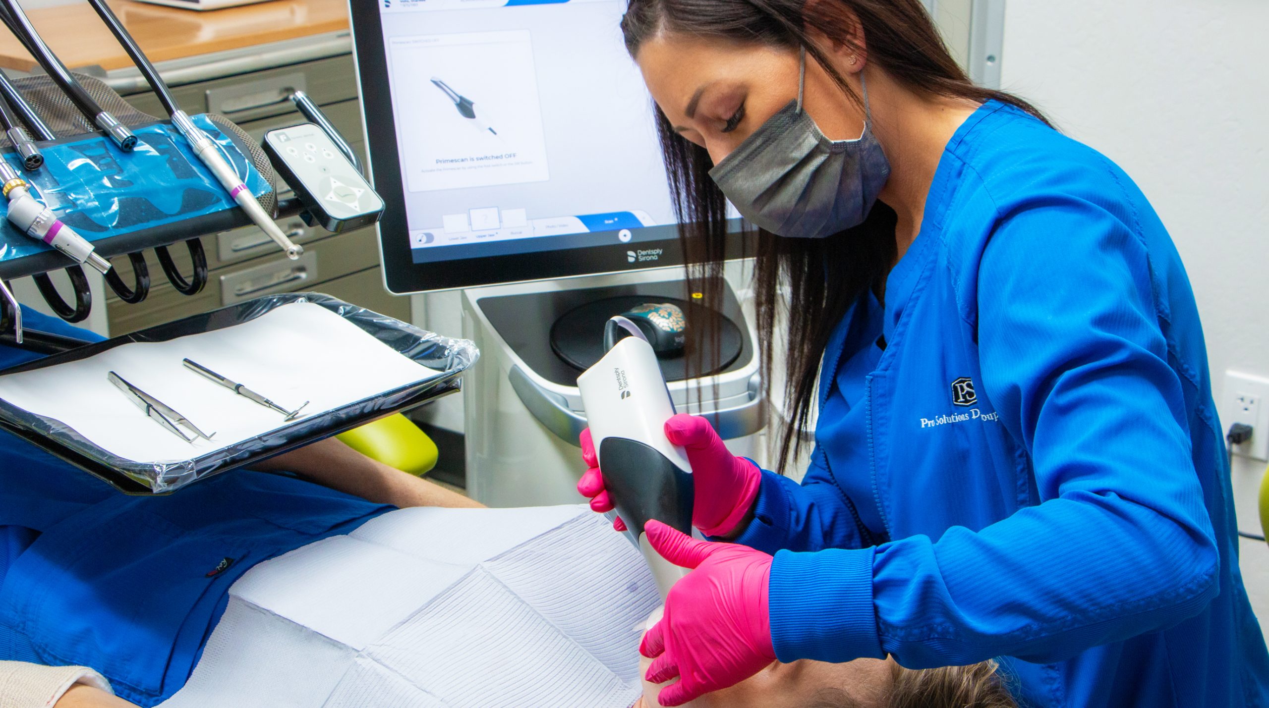 Dentist consulting with patient at Pro Solutions Dental Group